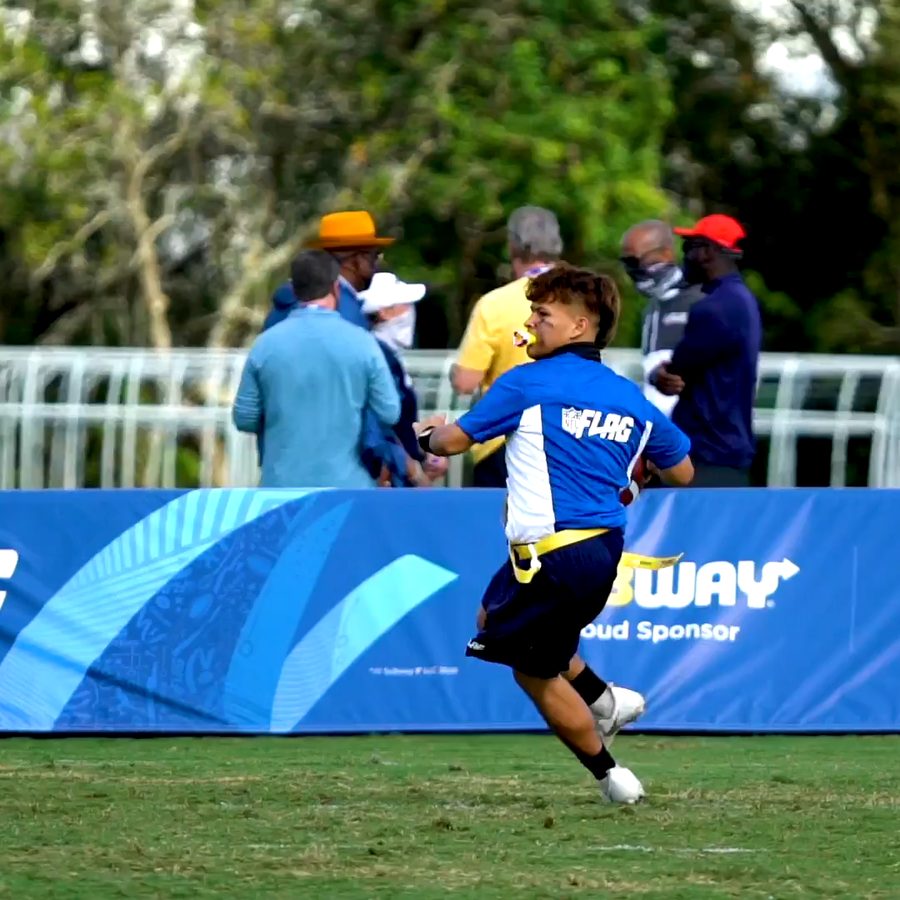 A player running with the ball at an NFL FLAG game